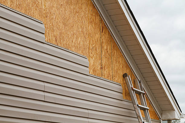 Professional Storm Damage Siding Repair technician working in Decatur, IN
